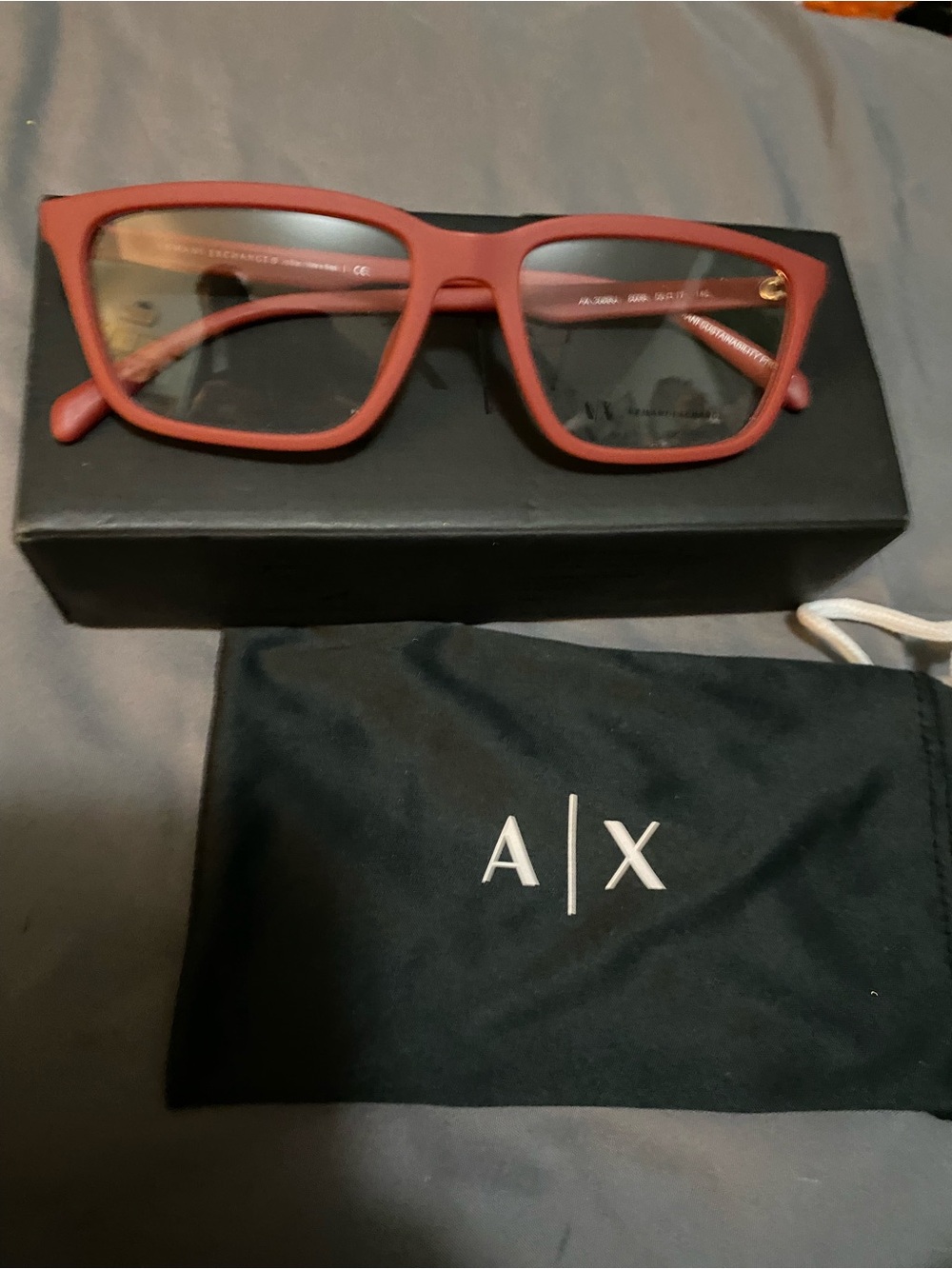 A/X Armani Exchange Men's red matte lens frames w clear lenses.